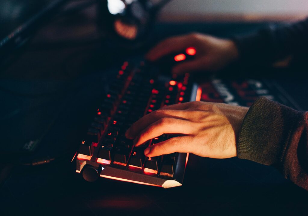 Image of two hands typing with a keyboard